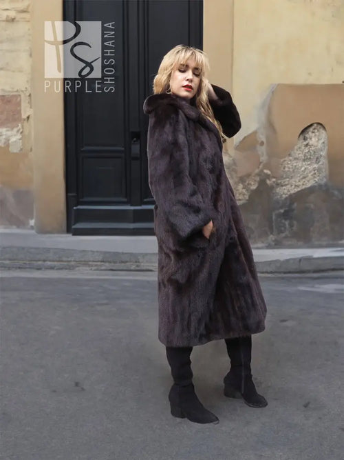 Dark mink fur coat with notched collar, long sleeves, layered full-length look.