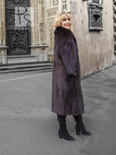 Dark mink fur coat with notched collar, long sleeves, side profile view.