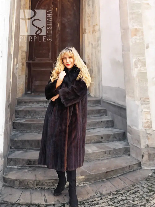 Black mink fur coat with black fox notch collar, long body and draped sleeves