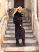 Black mink long coat with dark fur collar, button front, reaching mid-calf, long sleeves