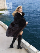 Black mink fur coat with fox notch collar, flared long silhouette and wide sleeves