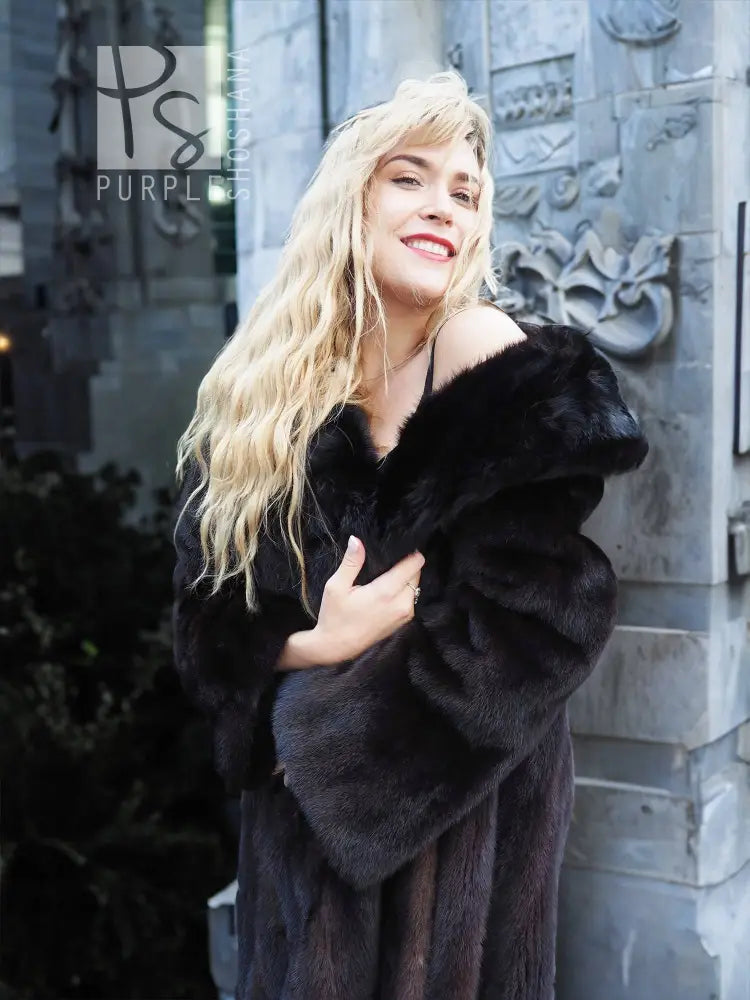 Black mink coat with plush dark fur collar, open neckline, long sleeves
