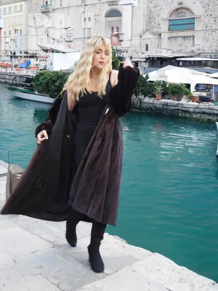 Black mink fur coat with fox notch collar, open front hem and long fur sleeves
