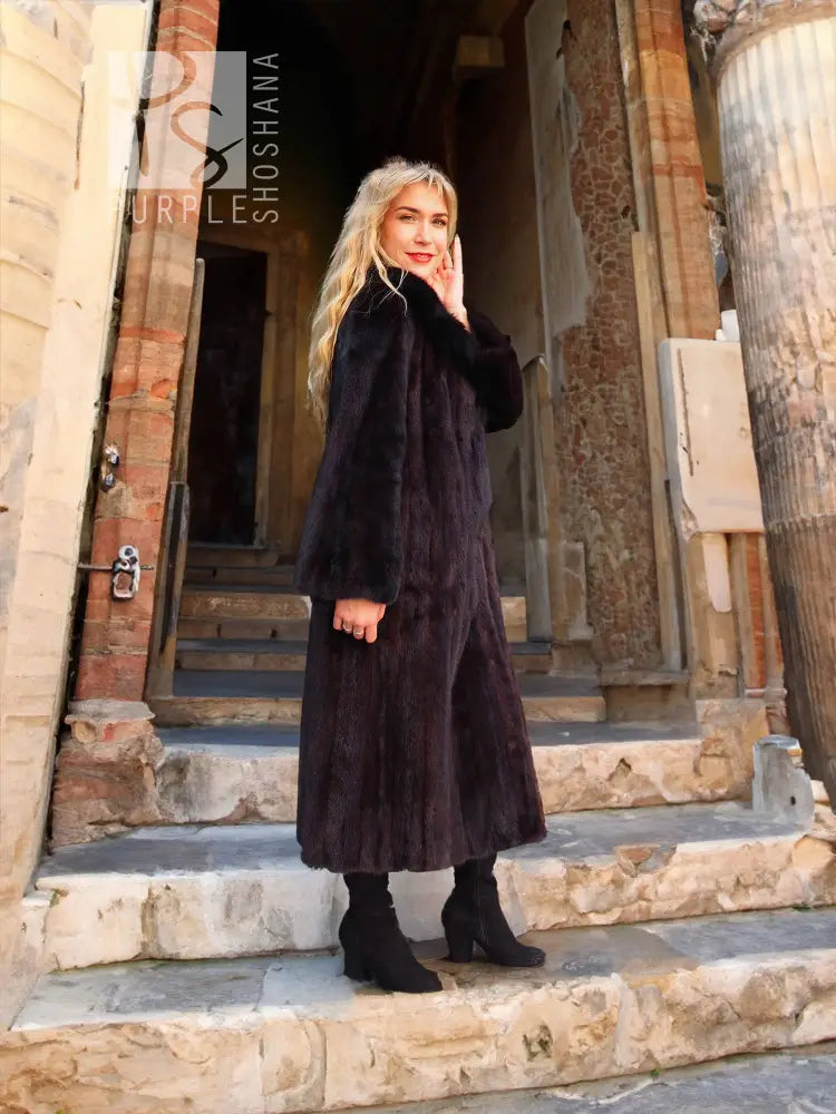 Black mink coat with dark fur notch collar and knee-length fit, button front, long sleeves