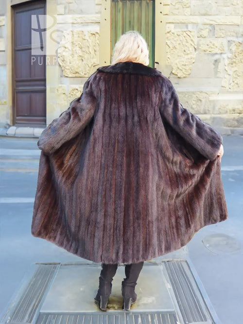 Back view of dark mink fur coat with black fox collar and full-length flared hem