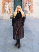 Black mink long coat with dark fur collar and button front, standing full length, long sleeves