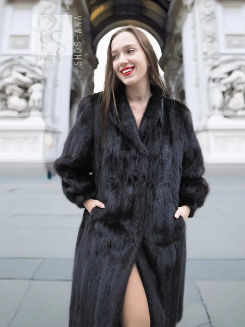 Black mink fur coat with raised collar detail, long sleeves, front view