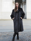 Black mink fur coat with long sleeves, buttonless front, knee-length hem