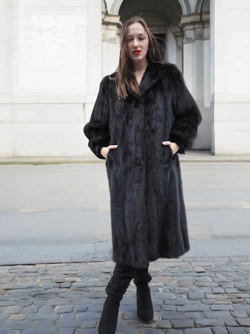 Black mink fur coat with long sleeves, buttonless front, knee-length hem