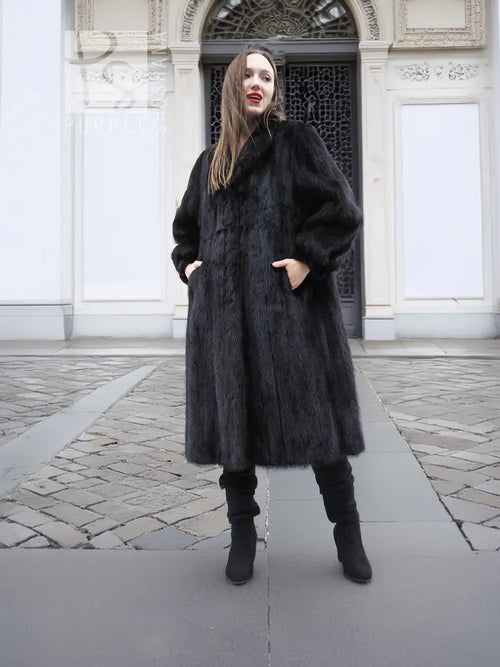 Black mink fur coat with high collar, long sleeves, mid-calf length