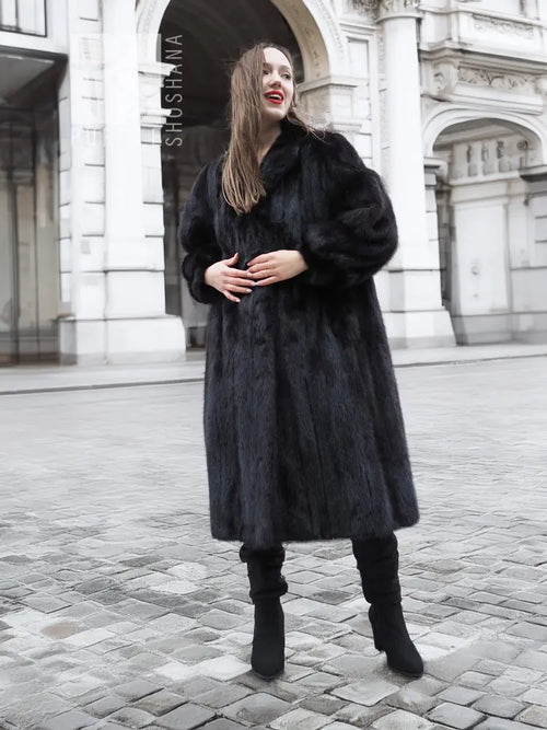 Black mink fur coat with buttonless front, long sleeves, knee-length hem