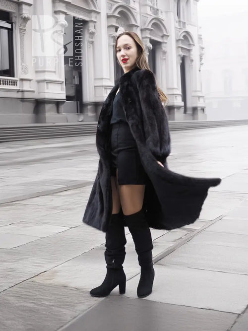 Black mink fur coat with flowing fur sleeves, front side view