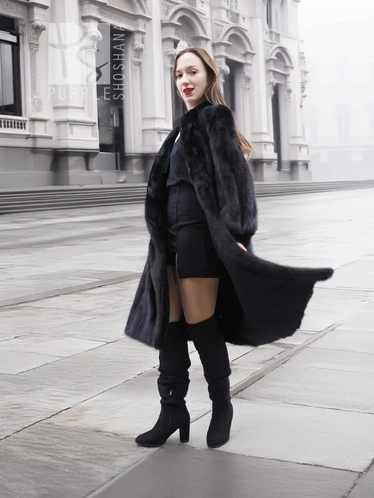 Black mink fur coat with flowing fur sleeves, front side view