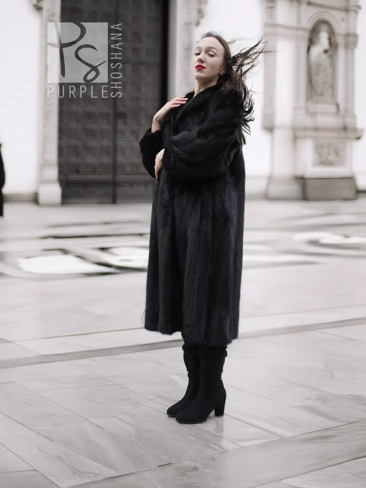 Black mink fur coat with hooded collar and long sleeves, full-length hem