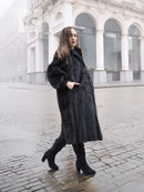 Black mink fur coat, three-quarter view with high collar and full skirt