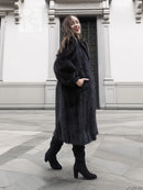 Black mink fur coat, long sleeves and full-length silhouette, front view standing