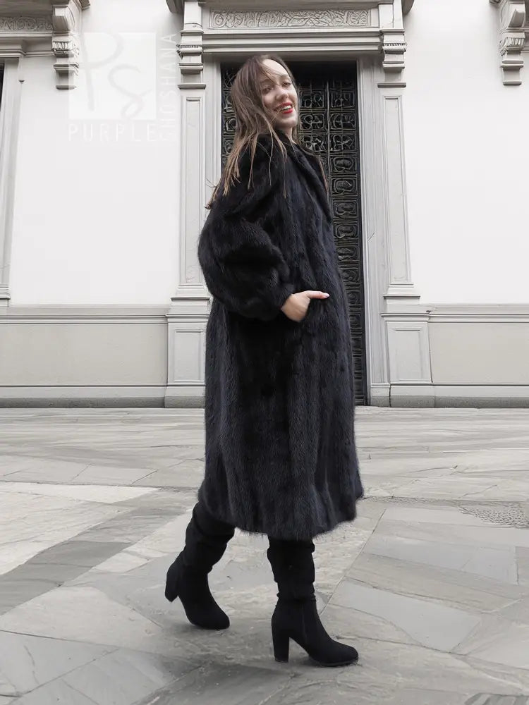 Black mink fur coat, long sleeves and full-length silhouette, front view standing