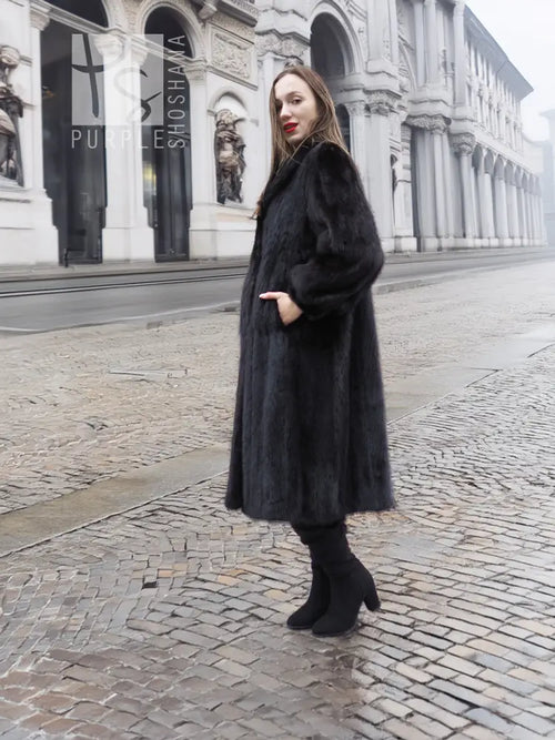 Black mink fur coat with high collar, long sleeves, mid-calf length