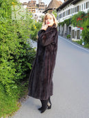 Long black mink fur coat with tall collar and full sleeves, straight silhouette