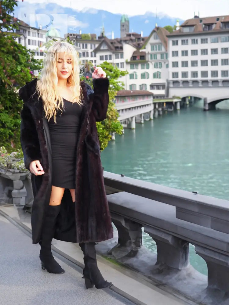 Black mink fur coat with hooded collar and straight long sleeves