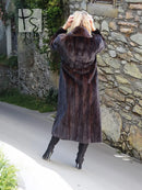 Black mink fur coat with hood-like collar, wide shoulders, long length and side pockets