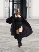 Dark mink fur coat with voluminous hooded collar, flared skirt and side drape