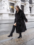 Black mink fur coat jacket with long sleeves and open front, knee-length hem.