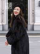 Black mink fur coat with wide collar, matching black fur hat, long sleeves