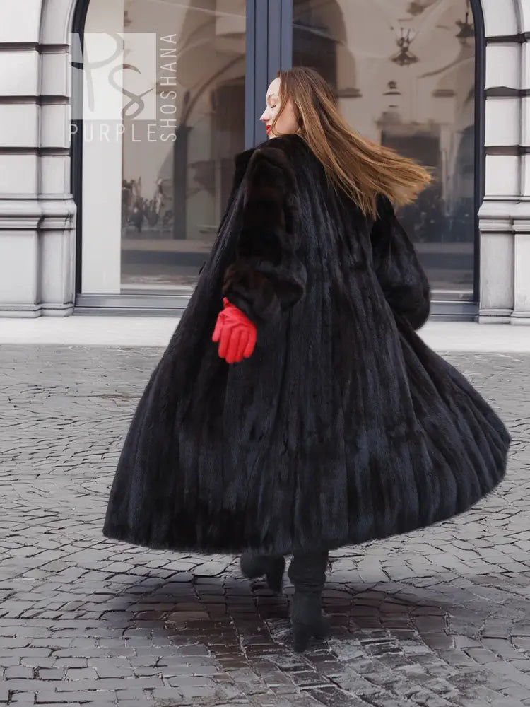 Black mink fur coat with full skirt flare and matching fur hat, long sleeves