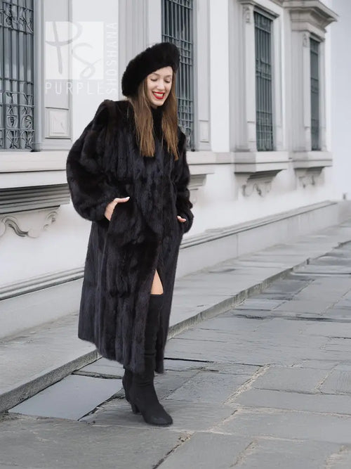 Black mink fur coat with open front slit and matching black fur hat