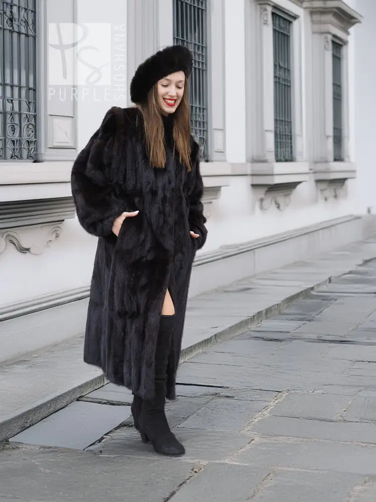 Black mink fur coat with open front slit and matching black fur hat