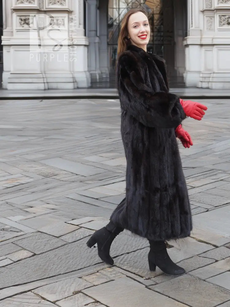Black mink fur coat, side walking view, large fur collar and red gloves