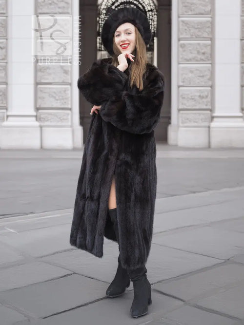 Black mink fur coat with front slit and matching black fur hat, knee length