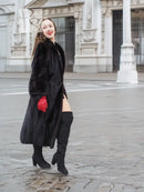Black mink fur coat, profile view, open front with large fur collar, red gloves