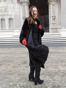 Black mink fur coat with relaxed fit, open front, and sculpted fur texture