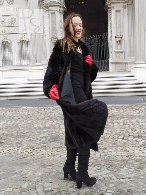 Black mink fur coat with relaxed fit, open front, and sculpted fur texture