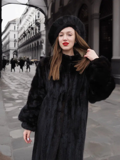 Black mink fur coat with wide collar and matching black fur hat