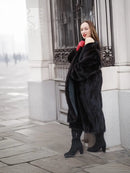 Black mink fur coat with wide collar, long sleeves, and side pockets