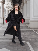 Black mink fur coat with open front and curved hem, red gloves, boots