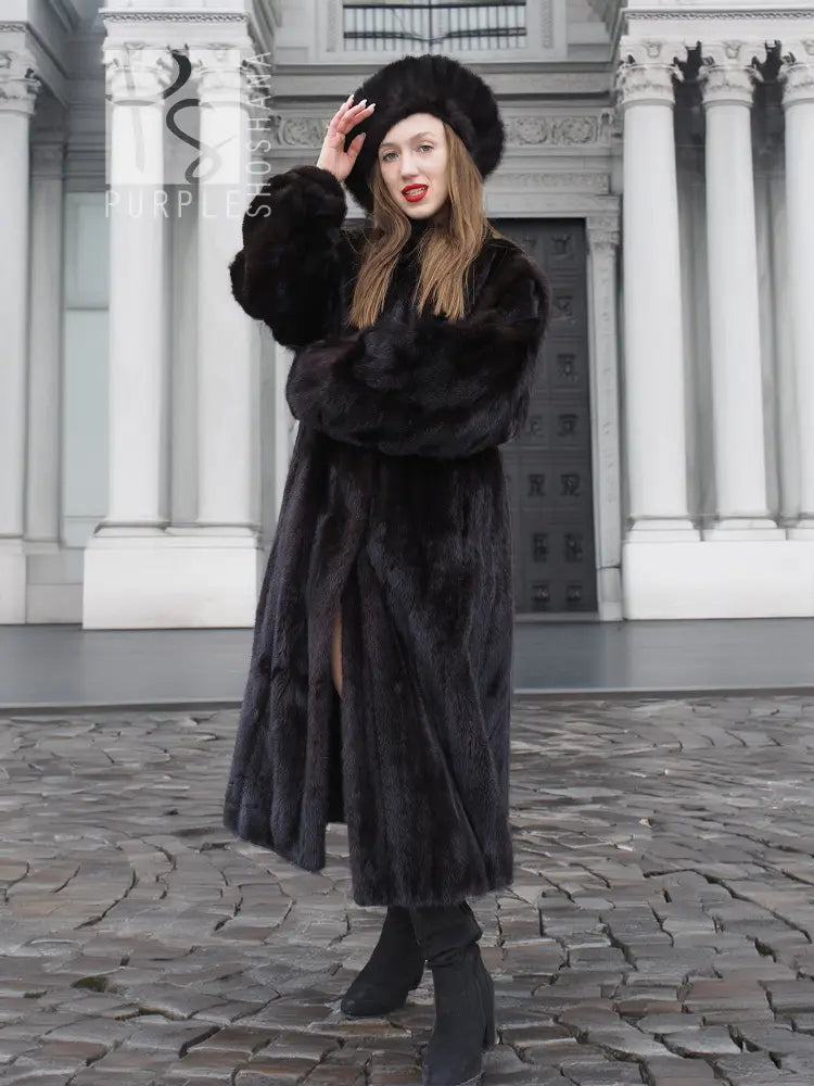 Black mink fur coat with thick fur texture, matching black fur hat, long sleeves