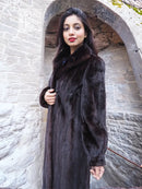 Women’s dark mink fur long coat with notched collar and full, flowing length