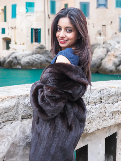 Dark mink fur jacket with large collar, shoulder-to-arm coverage, and close-up angle