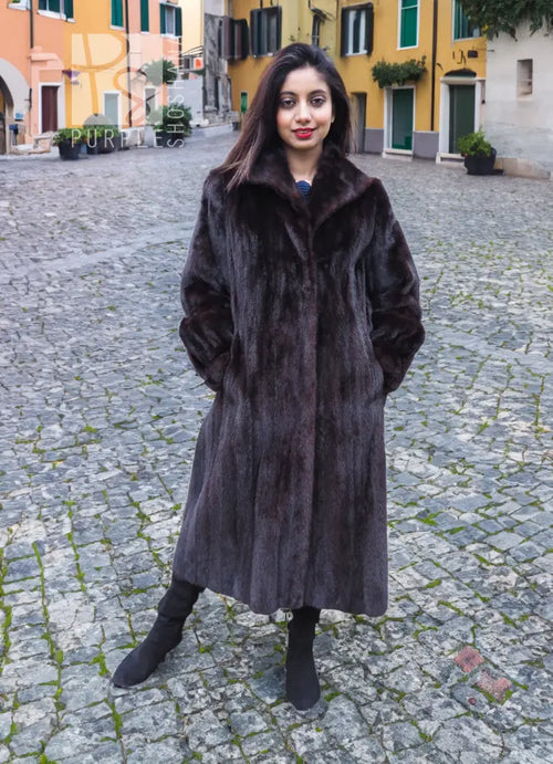 Long dark mink fur jacket with notched collar and full sleeves, front standing view