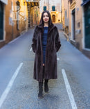 Women’s dark mink fur coat with notched collar, open front detail, and mid-calf length