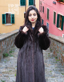 Dark mink fur coat with notched collar and plush texture, front view with arms raised