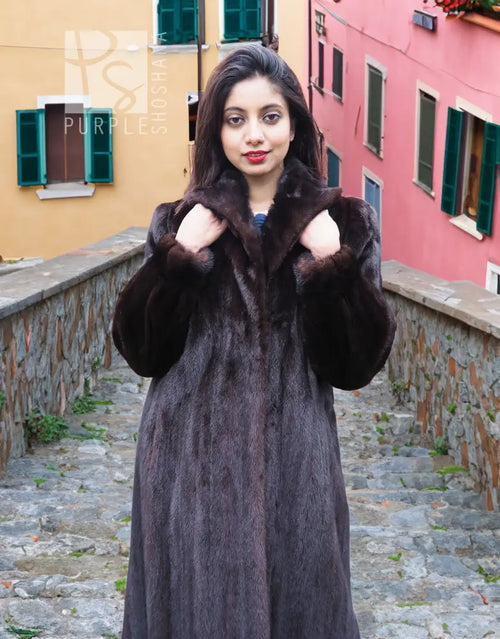 Dark mink fur coat with notched collar and plush texture, front view with arms raised