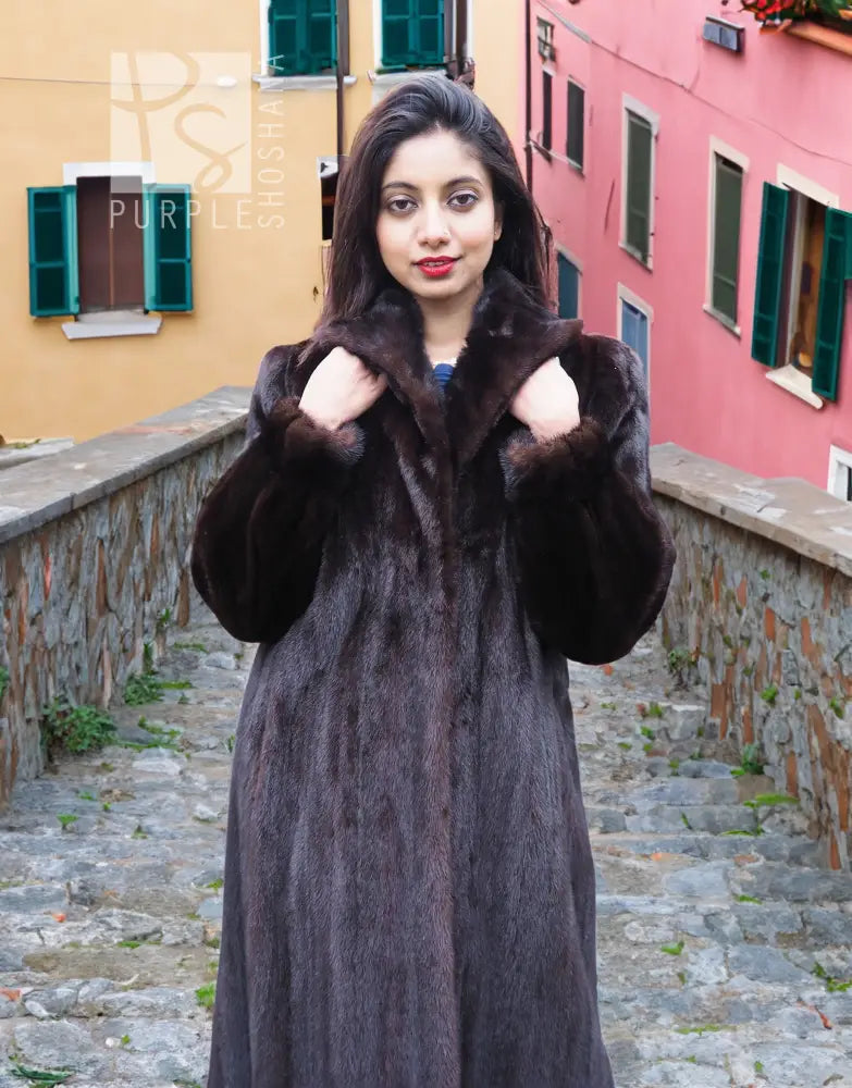 Dark mink fur coat with notched collar and plush texture, front view with arms raised