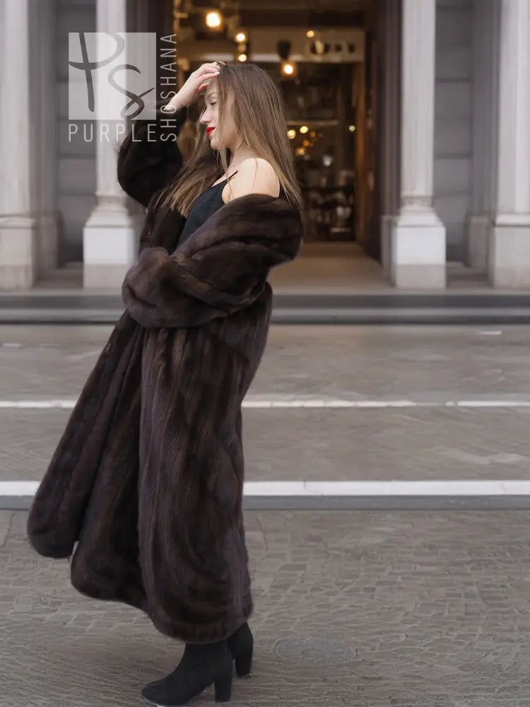 Dark brown mink fur coat with wide shawl collar, open front, full length