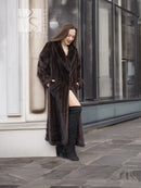Dark brown mink fur coat with hood, fitted sleeves and open front over pants