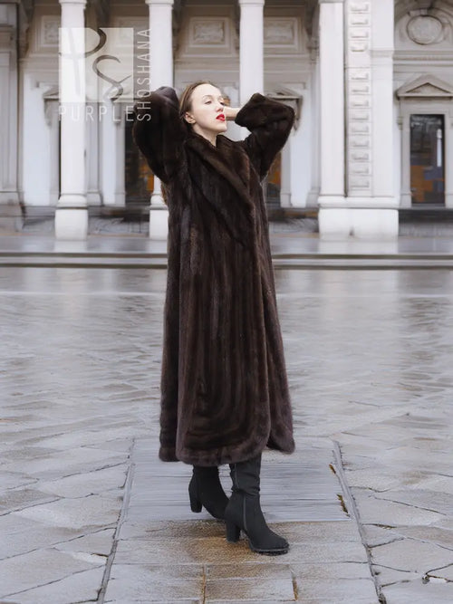 Long dark brown mink fur coat with wide collar and full sleeves, front view
